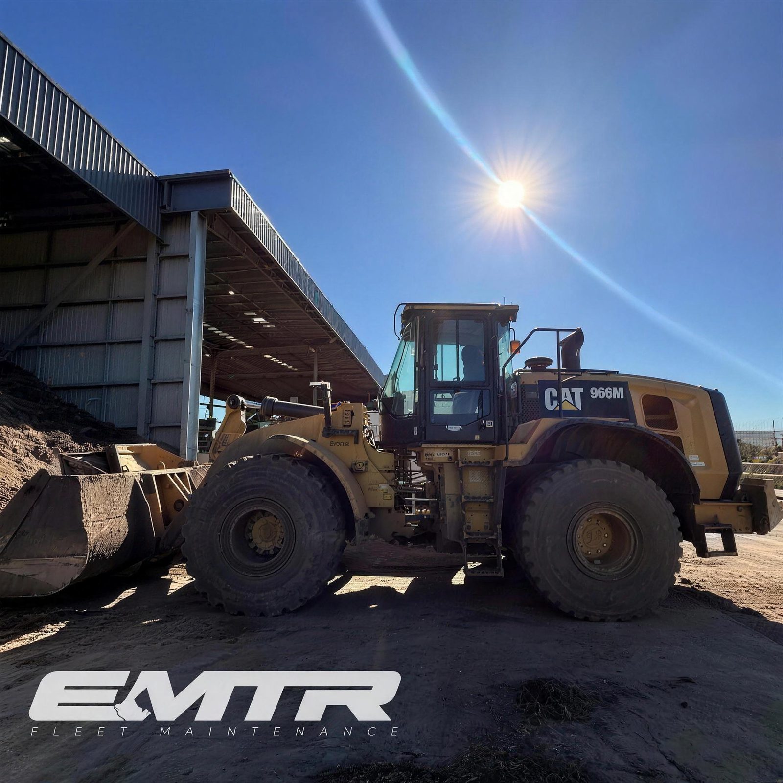 EMTR servicing a CAT 966M wheel loader on site
