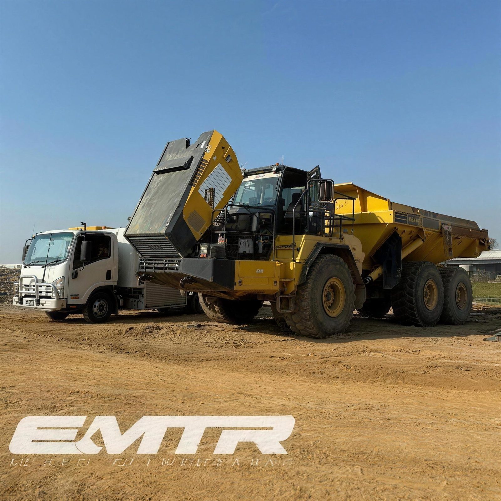 Truck and articulated hauler serviced on site